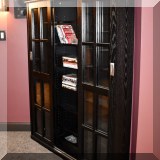 F48. Sliding door media cabinet. 60”h x 46”w x 9”d 